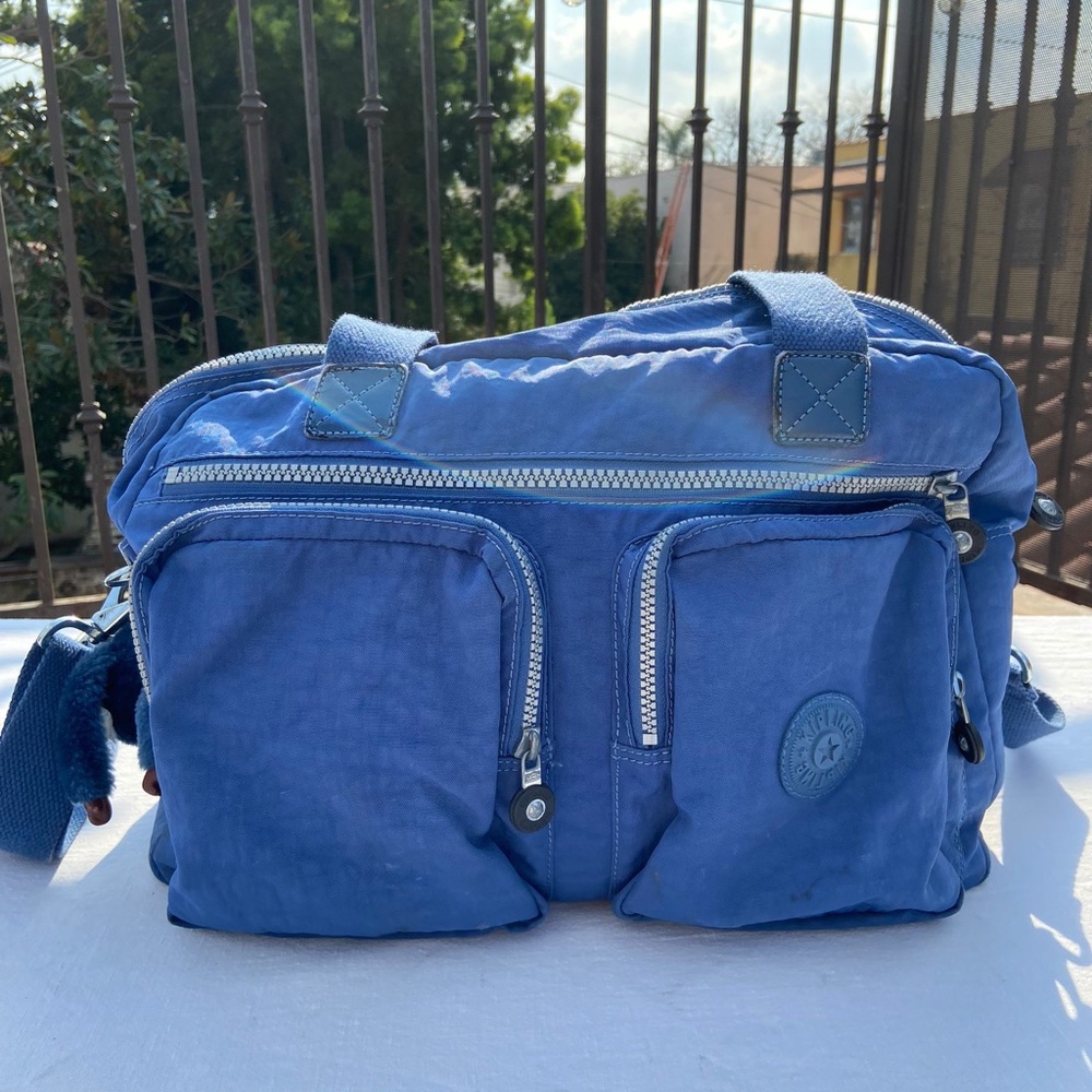 Blue Kippling overnight bag.